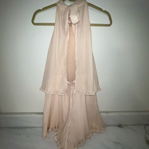 Adorable cream chiffon ruffle short romper with tie back. Open winged back. - Picture 7 of 13